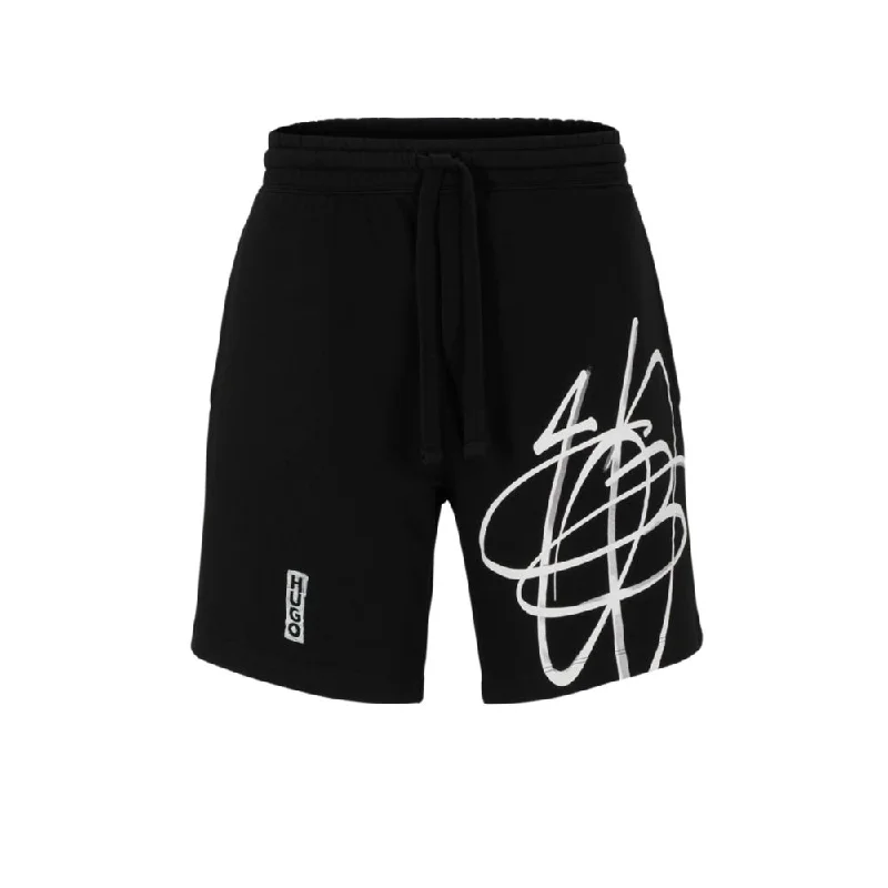 Relaxed-fit cotton shorts with graffiti-inspired logo